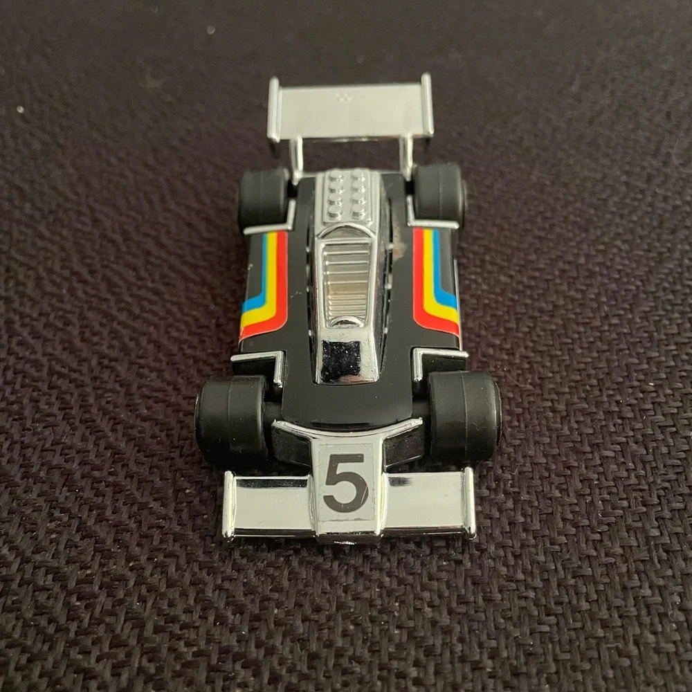 VTG 1979 Tonka black F1 race car w/ rainbow racing stripes